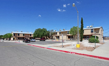 a street with cars parked in front of buildings